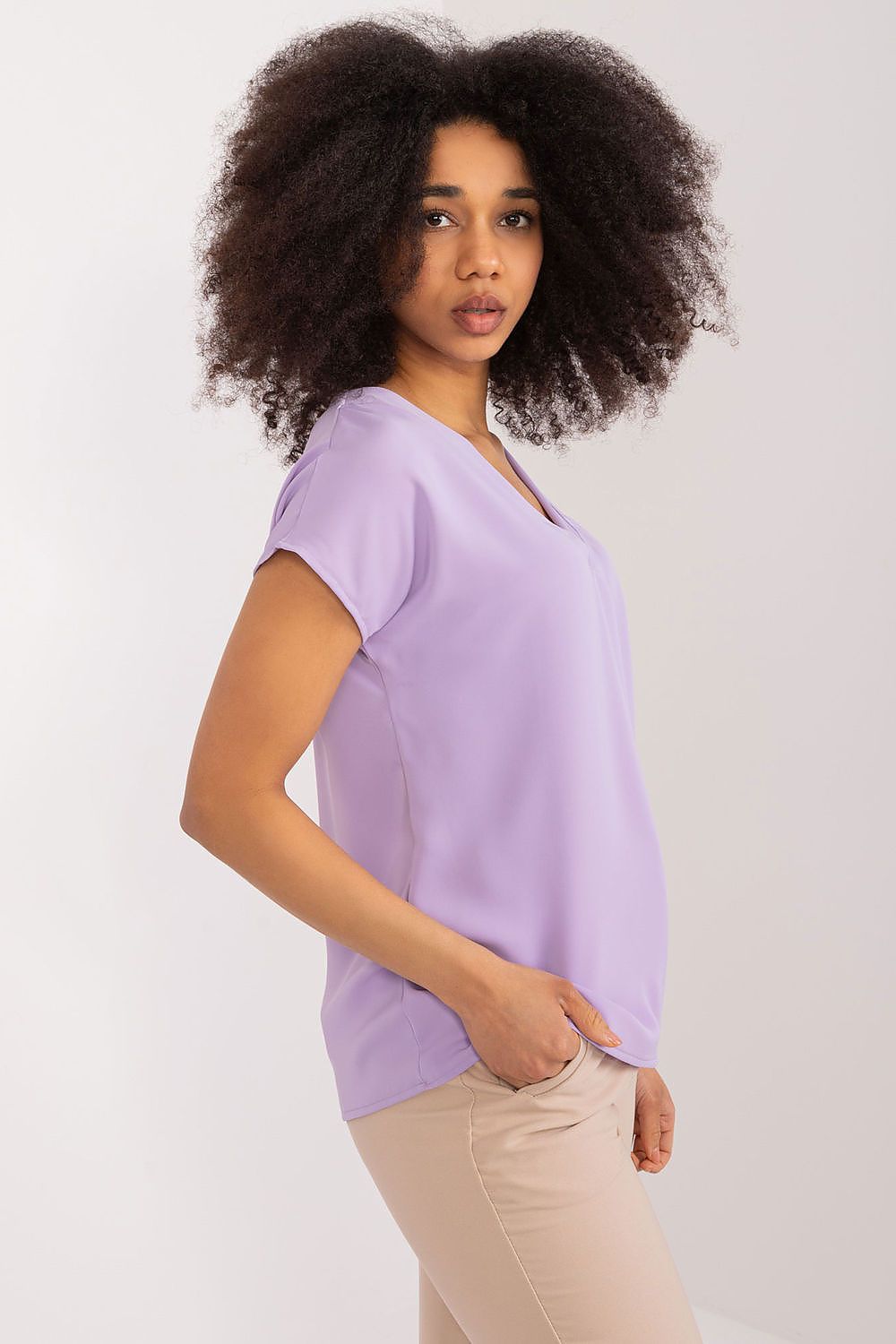 Stylish short sleeve blouse in a classic cut, made by BFG, ideal for warm days while maintaining a sophisticated look.