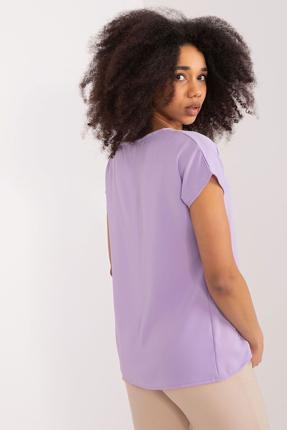 Elegant polyester blouse by BFG, showcasing simple yet chic fashion suitable for work or casual outings.