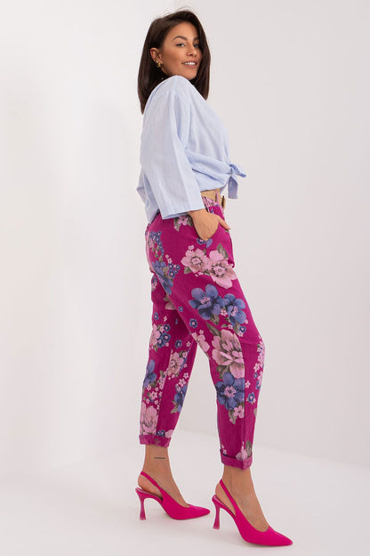 Chic high-waisted trousers with a subtle floral print by Italy Moda, designed for modern elegance and everyday wear.