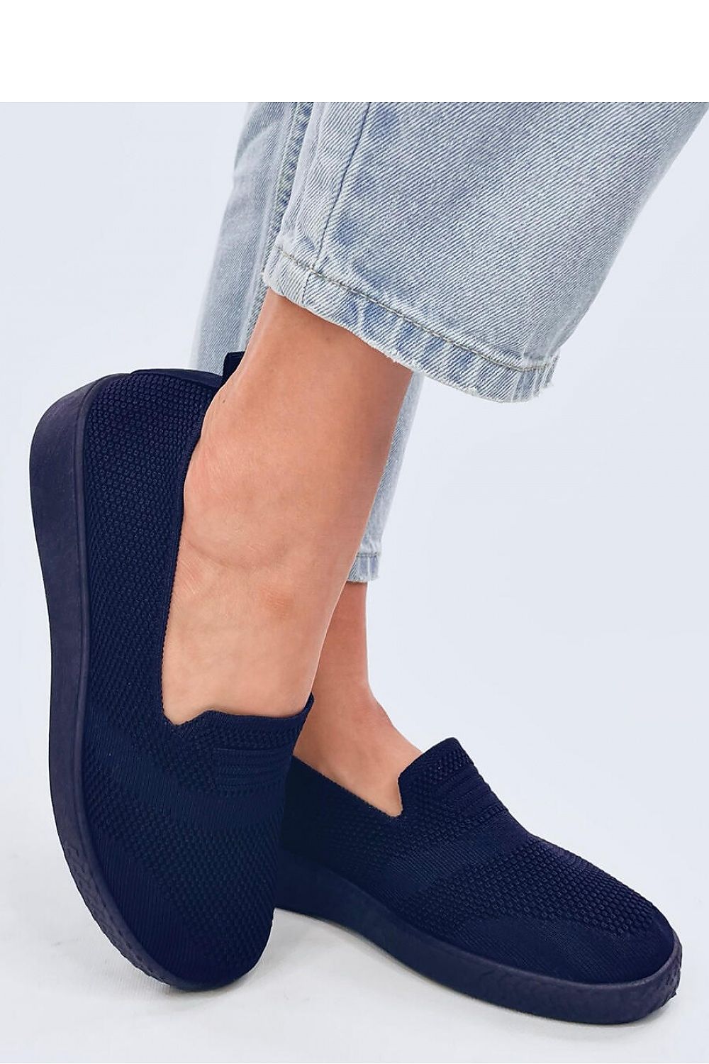 Luxury women's slip-on sneakers by Inello featuring lightweight and airy fabric with an elegant openwork design, perfect for stylish comfort and casual wear.