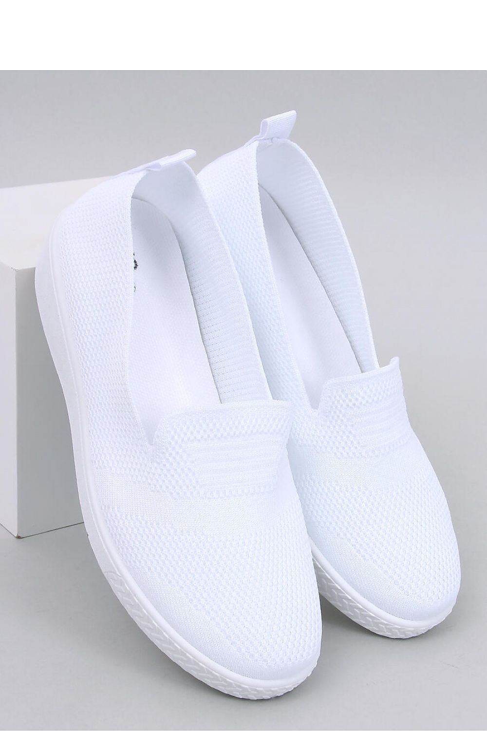 Elegant Women's Lightweight Slip-On Sneakers by Inello showcasing airy sock-like fabric in a subtle openwork pattern, perfect for casual luxury.