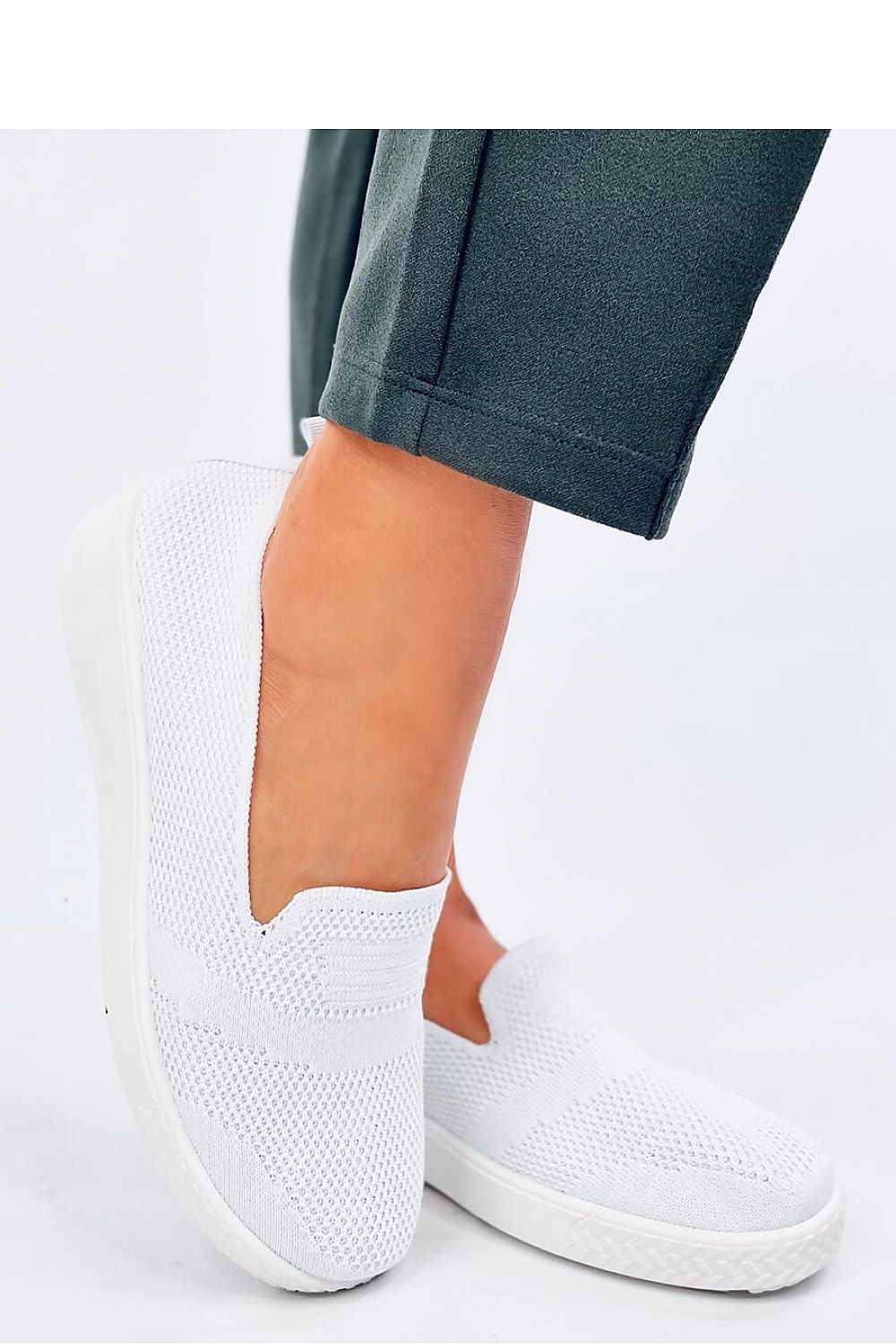 Sophisticated Women's Lightweight Sneakers by Inello featuring plush fabric and effortless slip-on design, combining comfort with refined style.