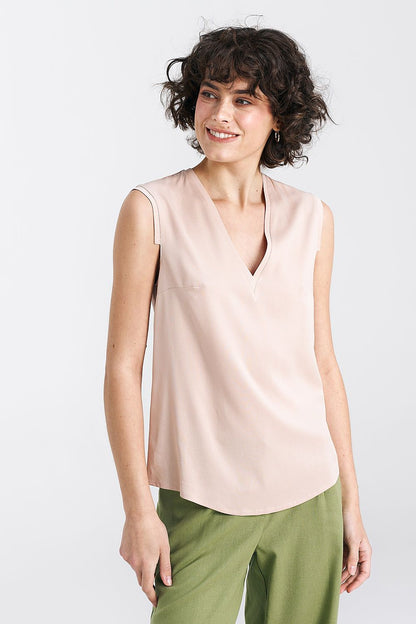 Nife viscose blouse in plum, beautifully styled for warm weather, illustrating its chic sleeveless design and elegant drape.