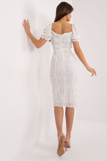 Detail shot of the puffed short sleeves and ruffled accents on the Lakerta elegant midi pencil dress, highlighting its feminine charm and exquisite design.