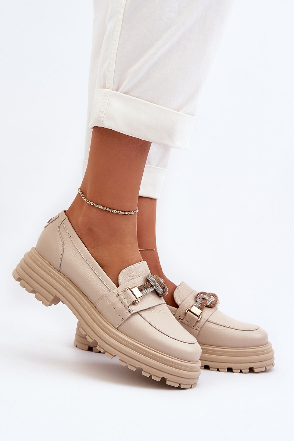 Luxury natural leather moccasin slippers by Step in Style, featuring a shiny loop detail for elegance and comfort. Perfect for those seeking fashionable and durable footwear.