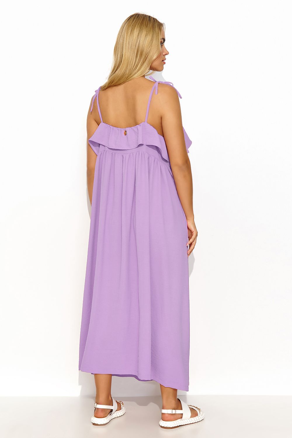 Elegant oversize long dress by Makadamia featuring a ruffle neckline and a hint of sparkle, perfect for warm weather occasions.