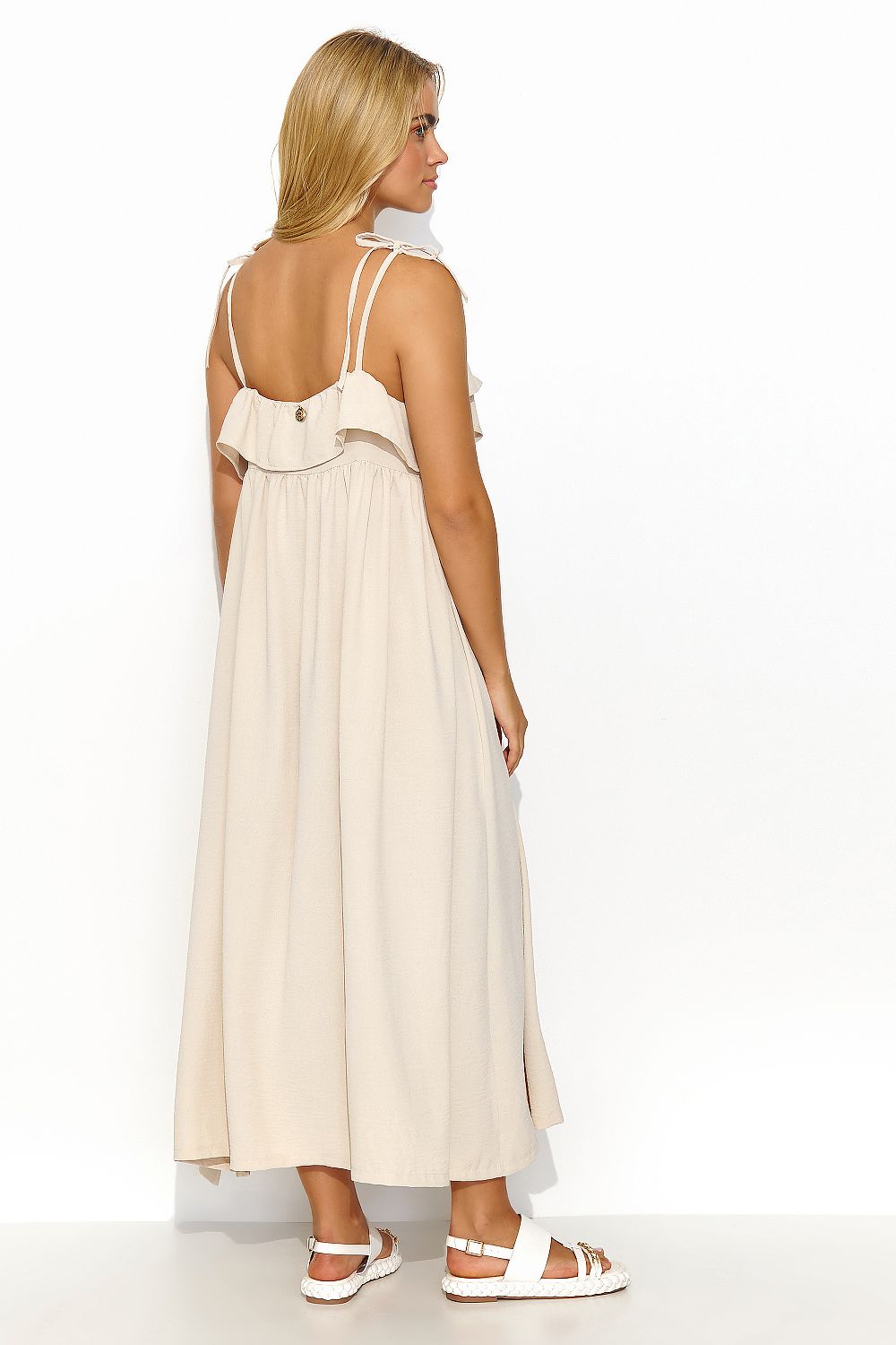 Stylish Makadamia long dress with a sensual ruffle neckline and airy fabric, perfect for chic casual wear.