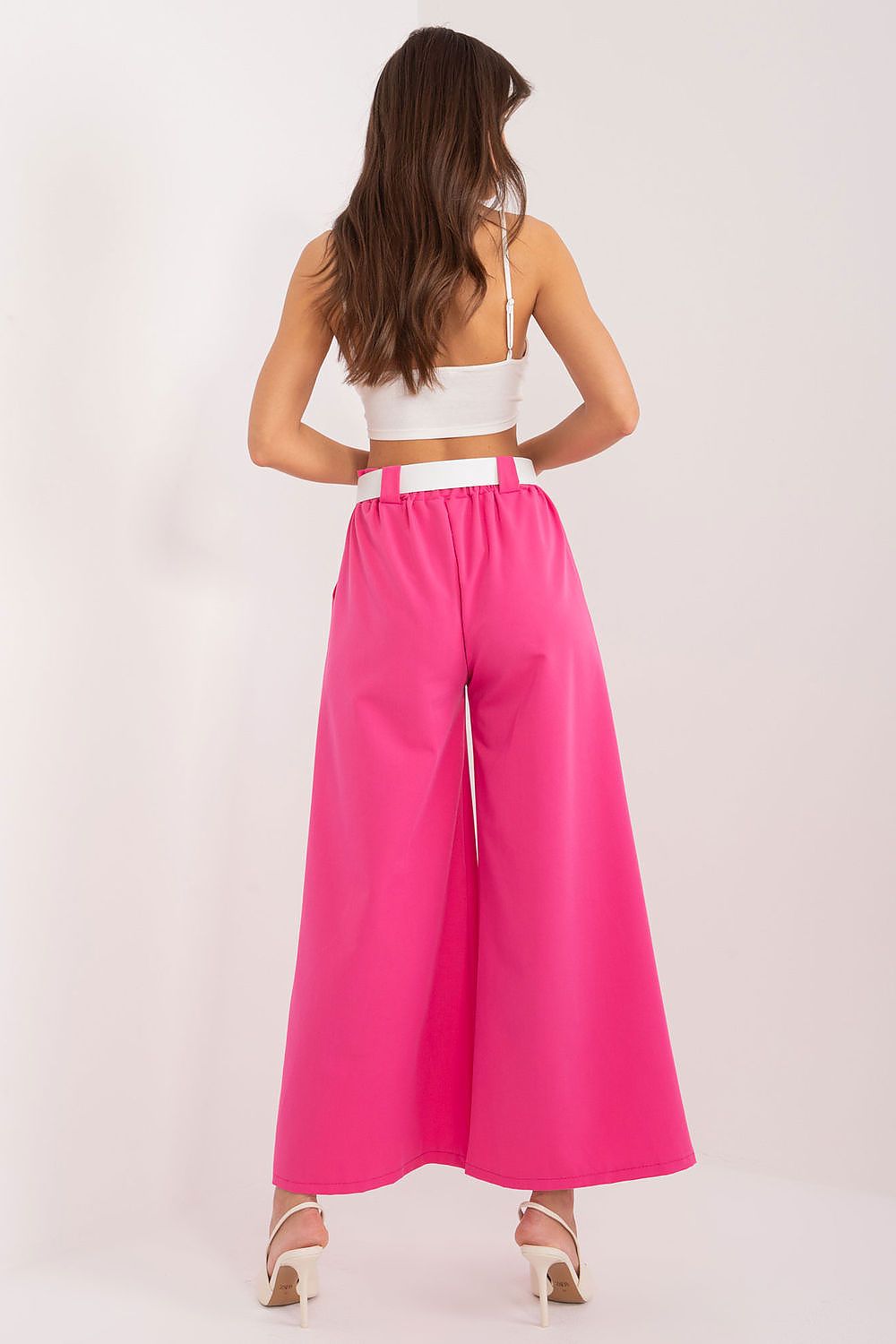 Elegant women's high waist palazzo trousers with pockets, designed by Italy Moda, showcasing a smooth polyester fabric that combines comfort and sophistication.