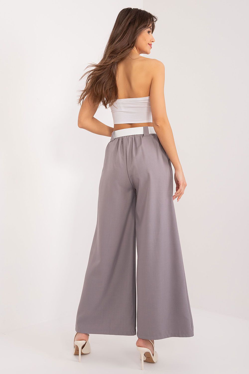 Luxurious women's palazzo trousers featuring an elastic waistband and belt, designed by Italy Moda for versatile elegance.
