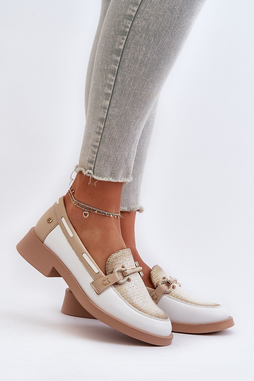 Chic Maciejka natural leather moccasins displayed on a model's feet, showcasing elegant design and comfort from Step in style.