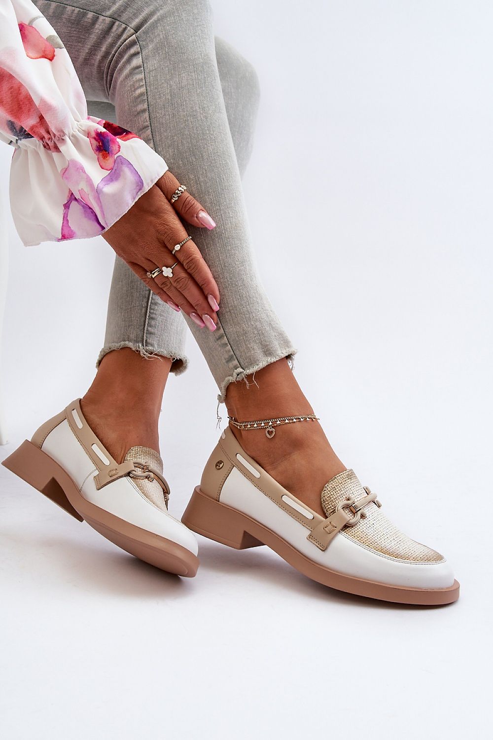 Elegant Maciejka natural leather moccasins showcased with chic embellishments, paired with stylish grey trousers, exuding comfort and luxury, by vendor Step in style.