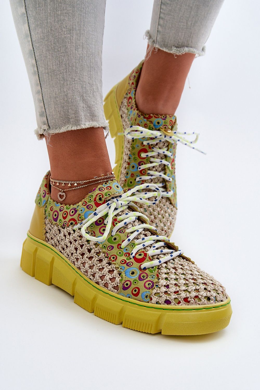 Close-up of luxurious women's half shoes featuring a colourful woven texture and comfortable fit, designed by Step in Style for fashionable elegance.