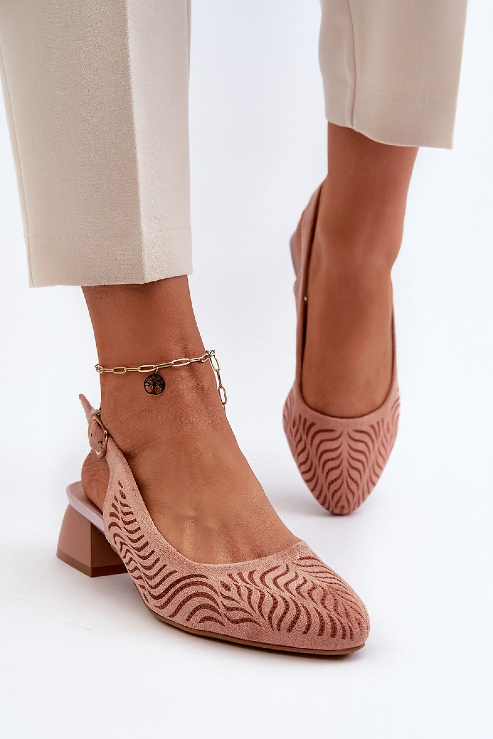 Chic Jezzi heel pumps showcased with a beautiful wave design, complemented by an adjustable strap and block heel, offering a perfect fit and comfort from Step in Style.