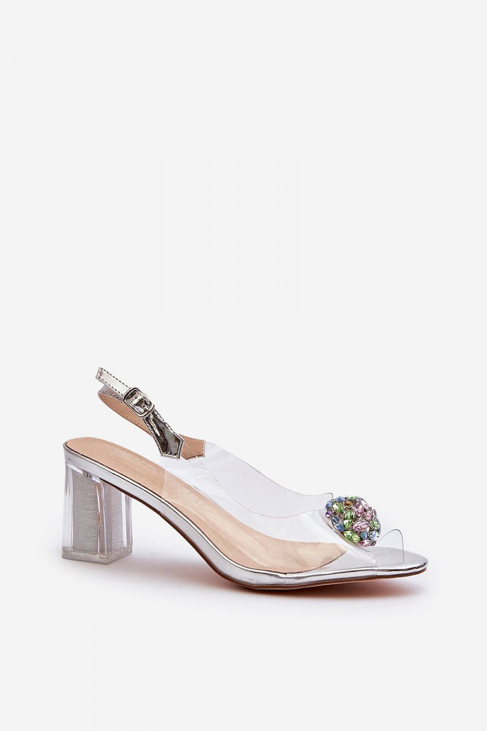 Refined clear heeled sandals by Step in Style with a delicate embellishment and adjustable strap, offering elegance and comfort for stylish ensembles.