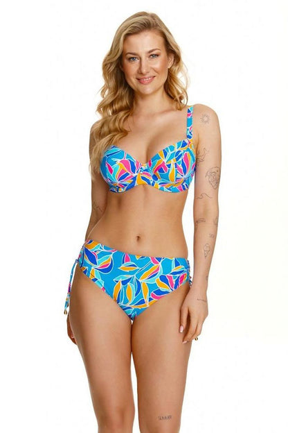 Elegant woman showcasing the Lupo Line Floral Swimming Bra, designed for medium to large busts, featuring vibrant floral patterns and supportive underwire, perfect for stylish beach outings.