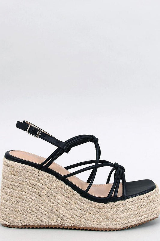 Elegant side view of Inello women's black platform espadrilles sandals with stylish cross straps and 11cm heel on a textured jute sole, perfect for sophisticated summer outings.