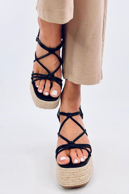 Fashionable front view of Inello black platform espadrilles sandals with 11cm heel, elegantly displaying the intricate strap design and tasteful styling for a luxurious summer look.