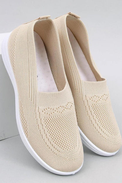 Inello Women's luxury slip-on sneakers featuring a breathable knit upper and springy white sole, ideal for stylish comfort on warm days.