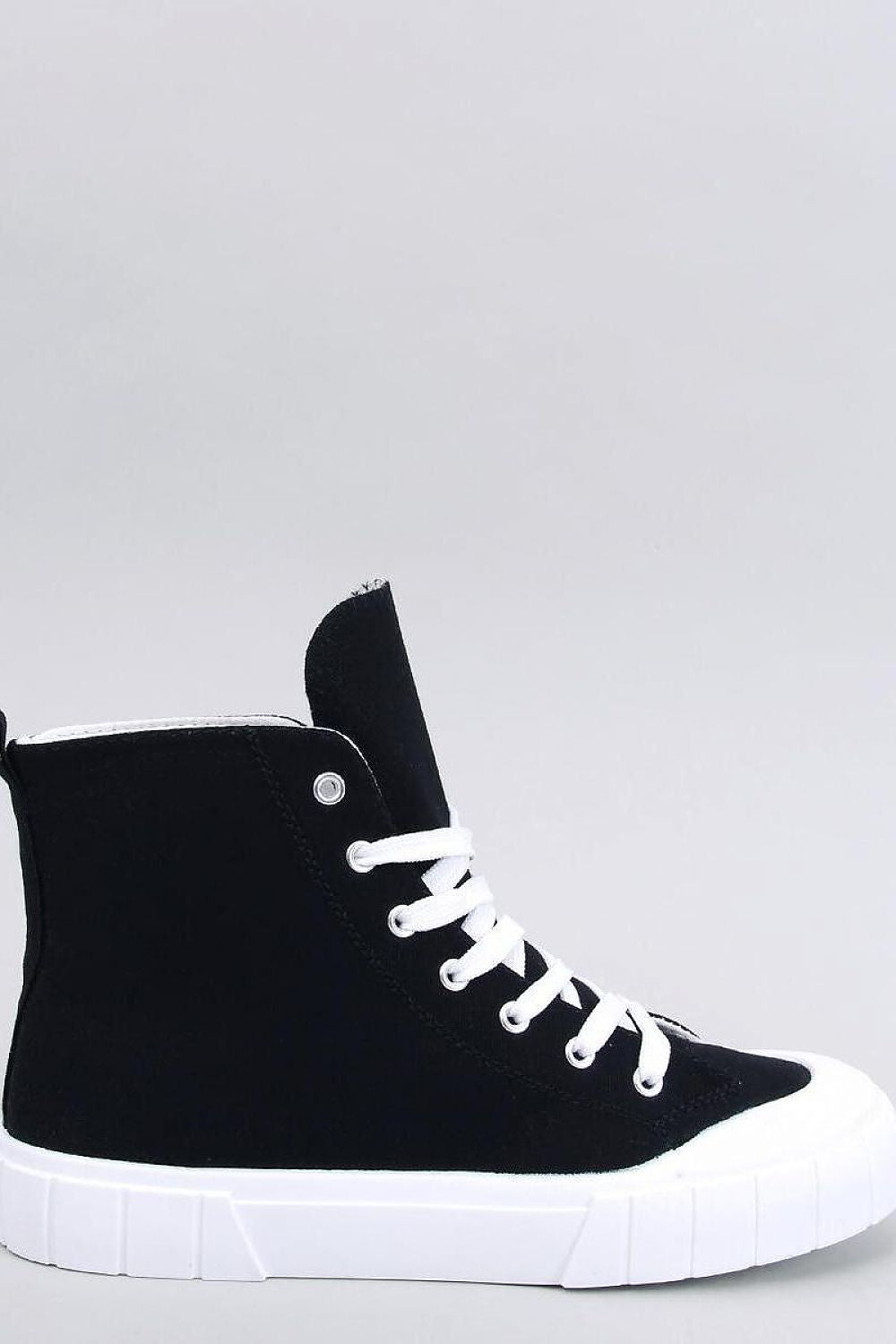 Elegant black women's canvas ankle sneakers by Inello, featuring a thick white sole, displayed in profile view against a neutral background. Perfect for fashionable ensembles.