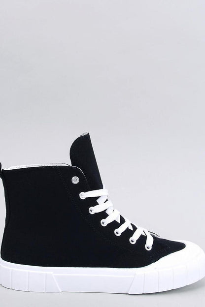 Elegant black women's canvas ankle sneakers by Inello, featuring a thick white sole, displayed in profile view against a neutral background. Perfect for fashionable ensembles.