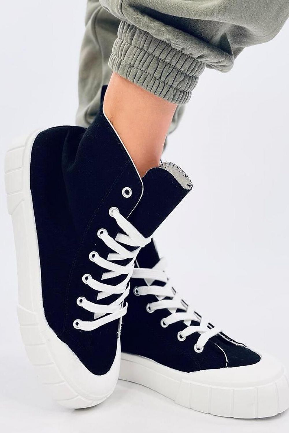 Chic black canvas ankle sneakers with a thick white sole by Inello, showcased from a different angle. Ideal for those who appreciate contemporary fashion.