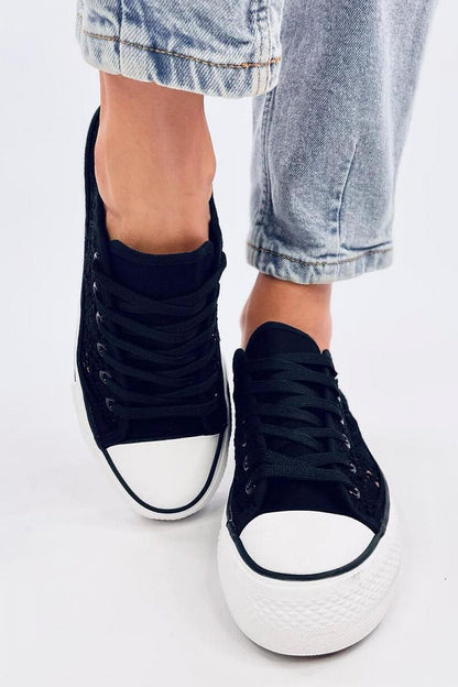 Elegant black lace-up sneakers from Inello featuring a stylish fabric upper and high sole, elegantly displayed with a focus on the athletic chic look.