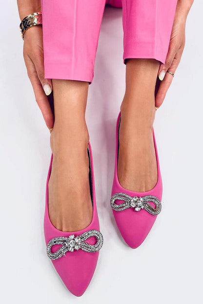 Stylish Inello ballerina flats in vibrant pink, adorned with a dazzling zircon bow, showcased on a model highlighting their luxurious design and comfort.