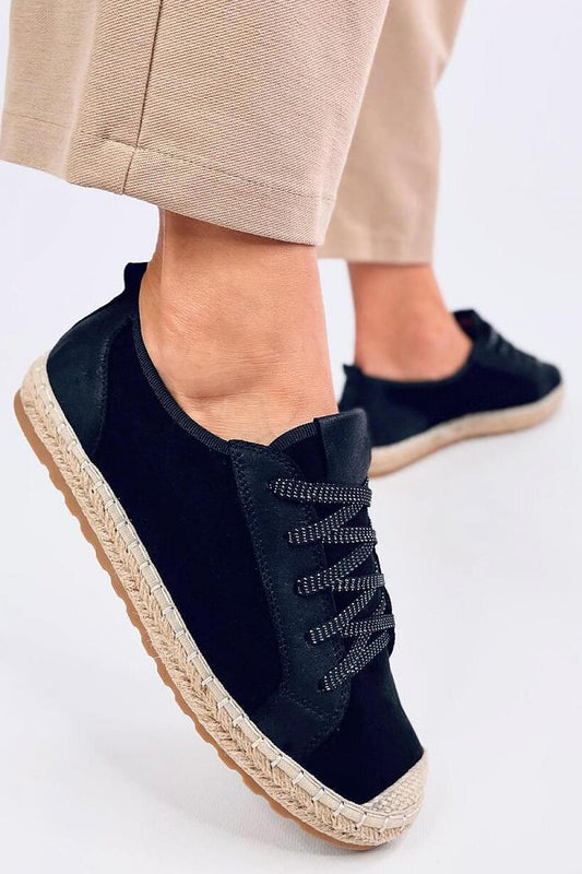 Stylish Inello women's lace-up espadrille sneakers with shimmering laces showcased on a model's foot, set against a minimal backdrop, perfect for spring and summer fashion.