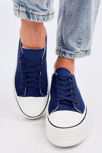 Chic navy blue platform sneakers by Inello, featuring a sleek lace-up style and high sole, effortlessly blending comfort and luxury for modern-day attire.