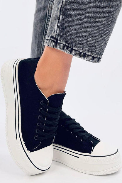 Stylish black platform sneakers by Inello showcased on a casual outfit, highlighting their trendy high sole and modern aesthetic.
