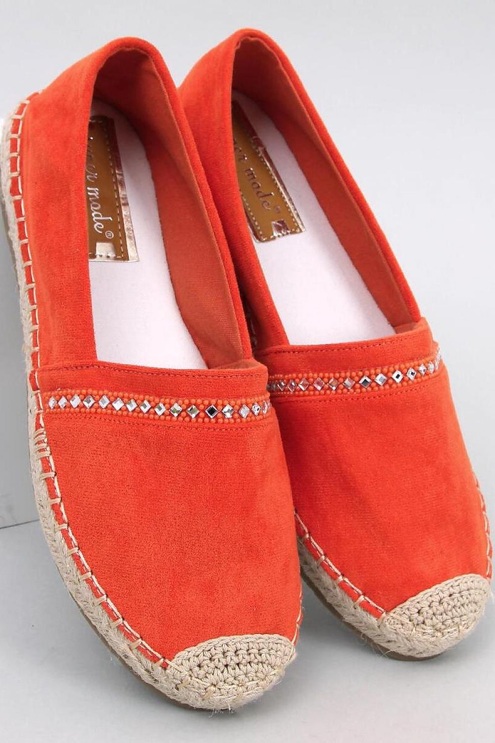 Luxury women's eco-friendly suede espadrilles in vibrant orange with stone accents, designed by Inello for upscale summer styling.
