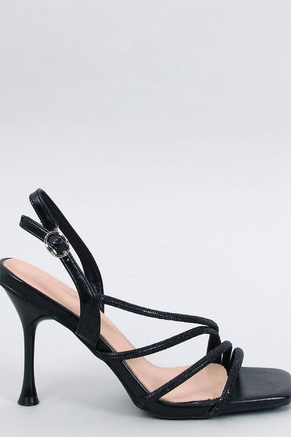 Elegant black stiletto heel sandals by Inello, featuring intricate sparkling embellishments and a sleek design, perfect for a luxurious evening look.