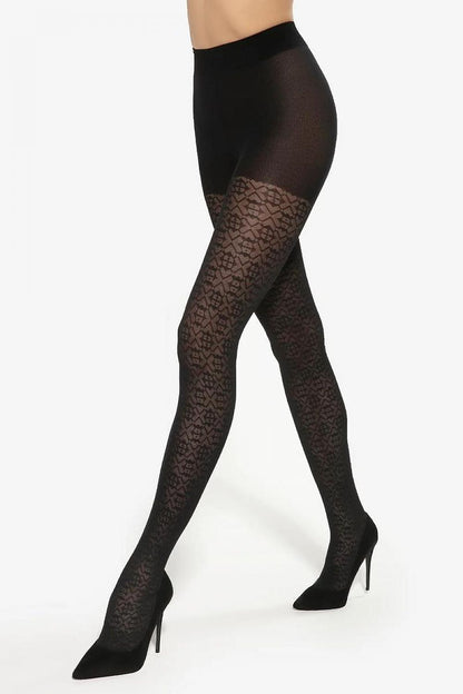 Elegant model showcasing Gatta black Optica patterned tights, featuring a stunning 3D illusion design, paired with chic high heels, perfect for a luxurious outfit.