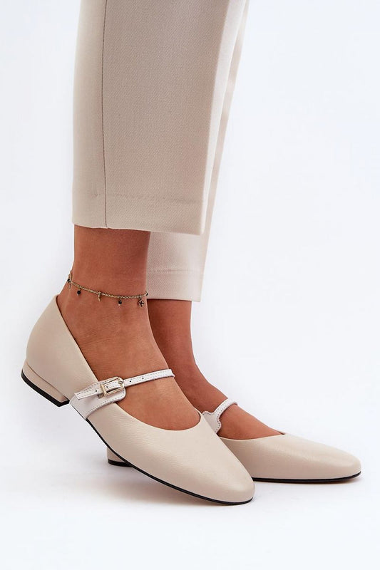 Elegant luxury natural leather ballet flats by Step in Style, featuring an adjustable strap and a rounded toe, being worn with stylish trousers.