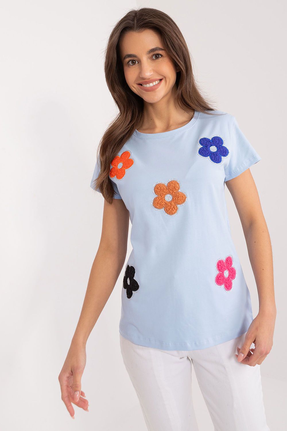 Charming cotton blouse by BFG featuring vibrant floral decorations in a range of colours, ideal for casual summer wear.