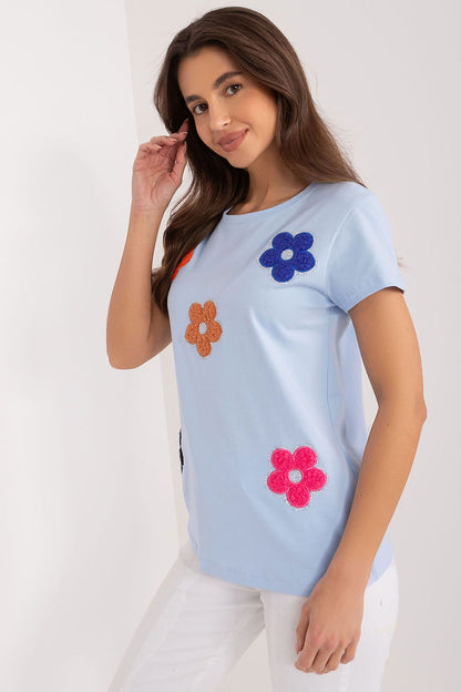 Side view of a delightful cotton blouse by BFG, embellished with colourful floral accents, perfect for summer styling.