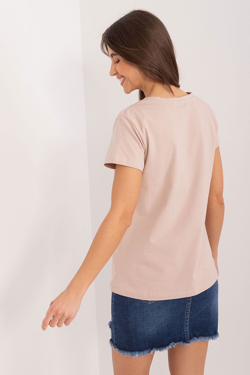 Back view of a stylish beige floral decorated cotton blouse, showcasing its elegant simplicity, designed by BFG.