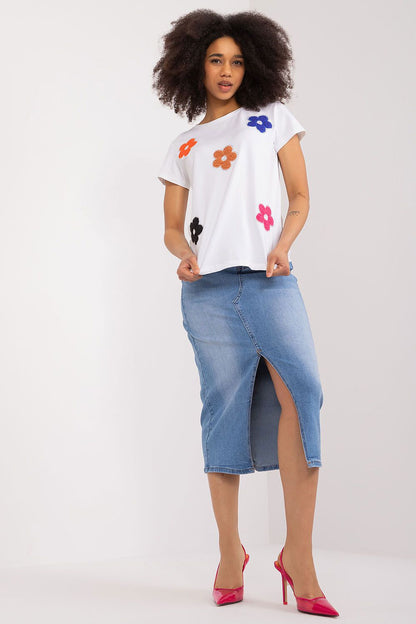 Chic white floral blouse paired with a denim skirt, exuding summer elegance, styled by BFG.