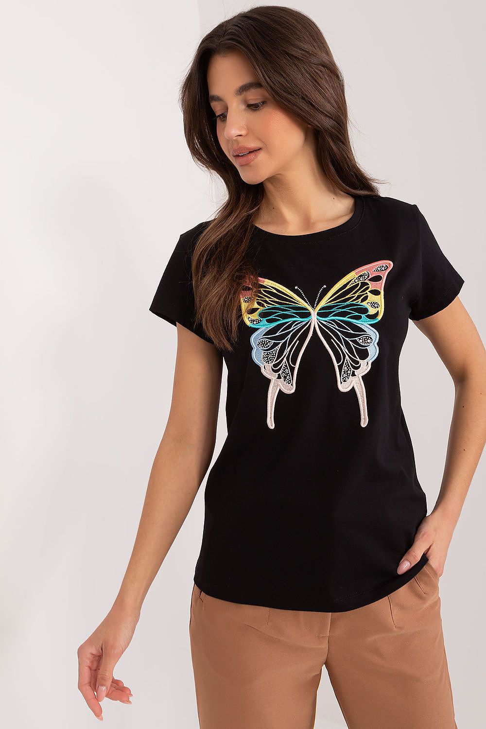 BFG casual cotton blouse featuring a vibrant butterfly design embellished with artful zircons, worn by a graceful model in a black background, exuding sophistication and elegance.