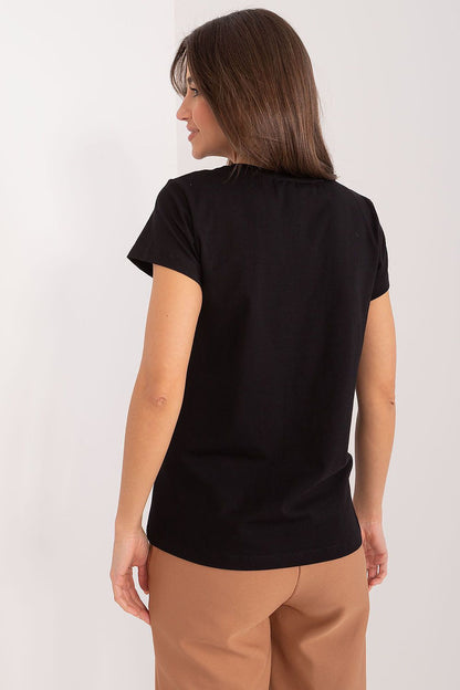 Back view of a chic BFG casual cotton blouse with a butterfly detail, presented by a model against a minimalist background, illustrating timeless elegance.