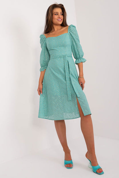 Chic full view of a turquoise midi summer dress by Lakerta, featuring puff sleeves and a flattering waist tie, perfect for summer elegance.