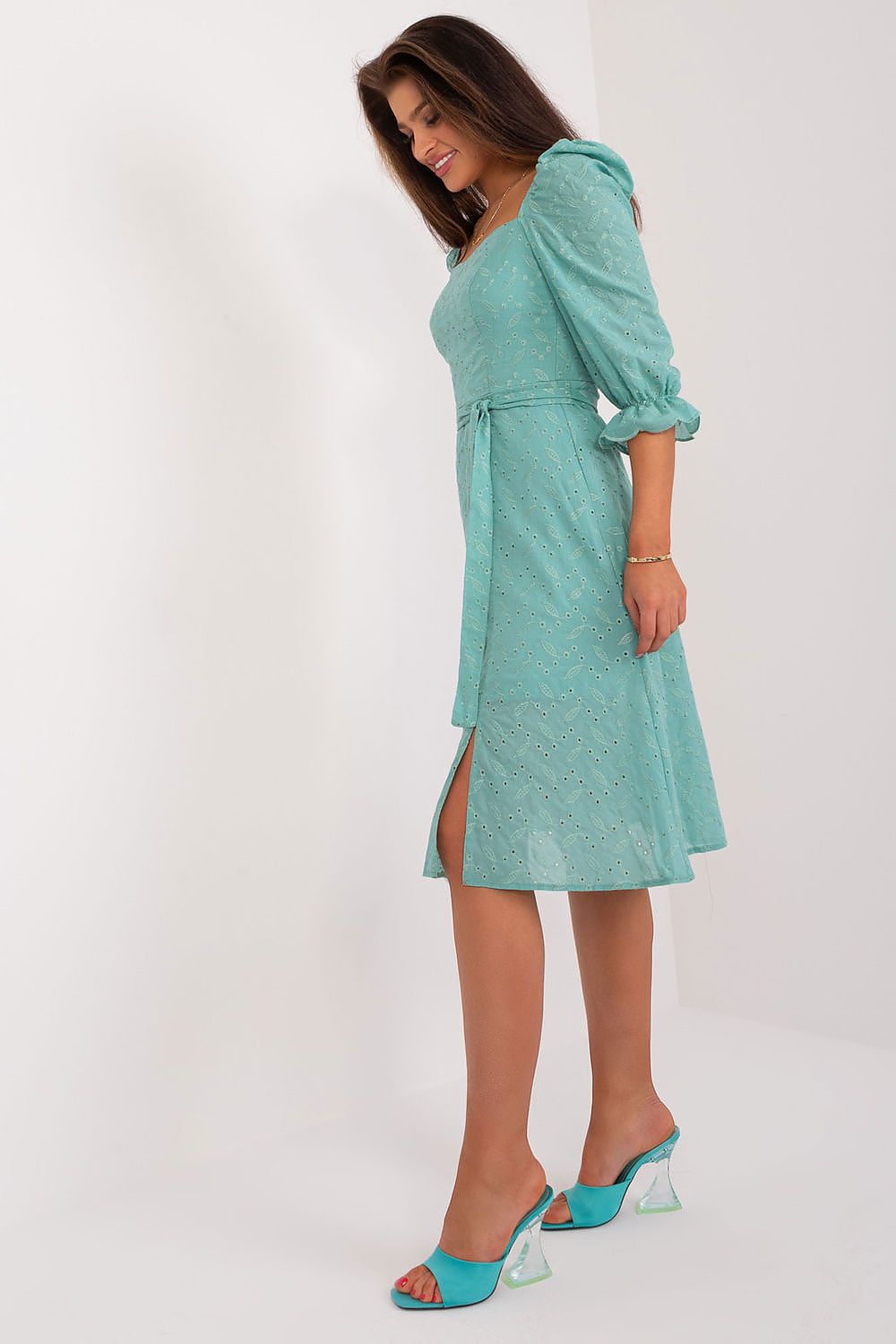 Stylish mint green midi summer dress by Lakerta, showcasing puff sleeves, a tie belt, and a side slit, ideal for casual summer outings.