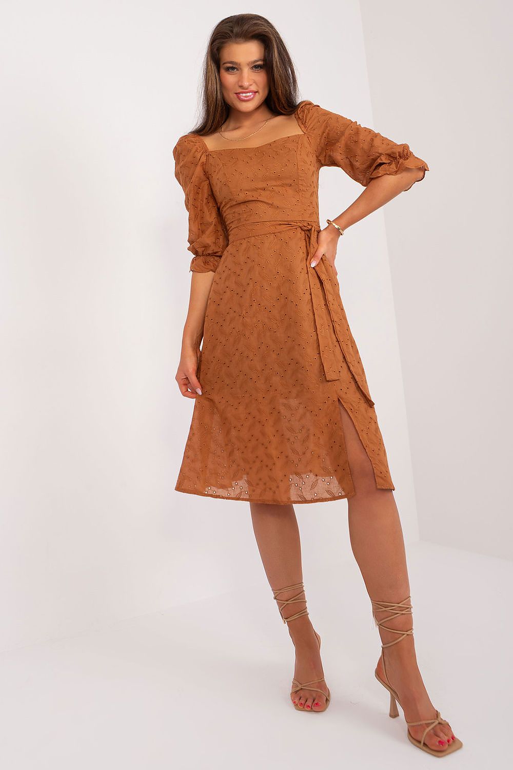 Fashionable brown midi dress by Lakerta, featuring puff sleeves, a stylish tie belt, and a flattering side slit, suitable for elegant summer events.