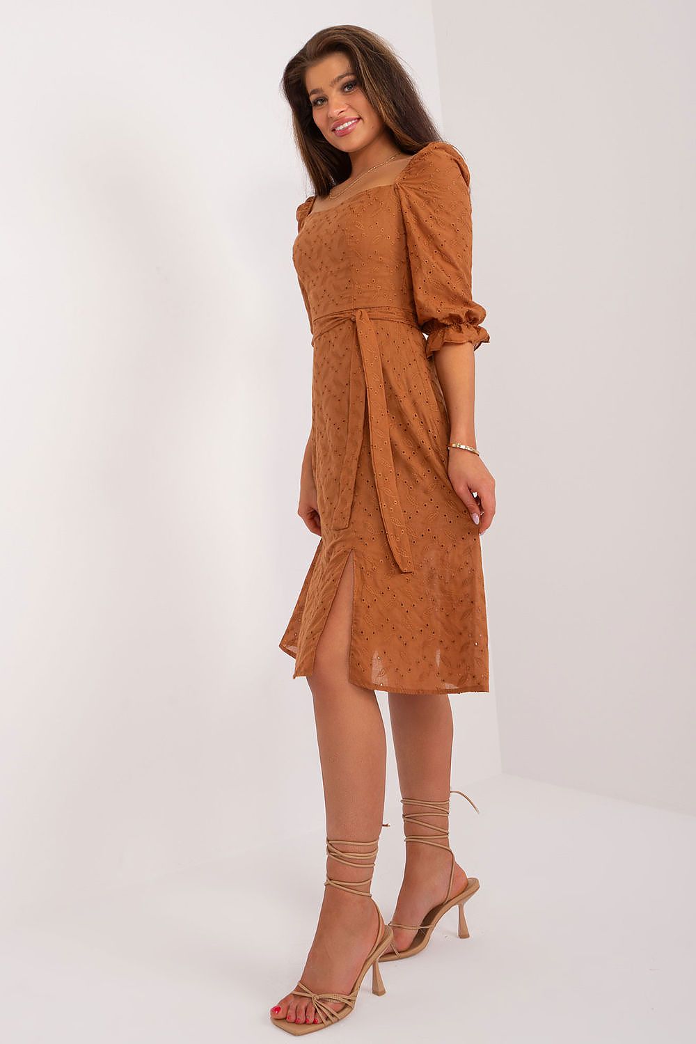 Beautiful brown midi dress with puff sleeves and a tie belt by Lakerta, complemented by subtle embroidery, perfect for stylish summer gatherings.