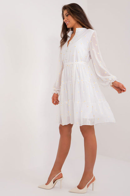 Sophisticated flared dress by Lakerta with intricate flower embroidery, ruffle detail, and a flattering tie belt, ideal for formal events.