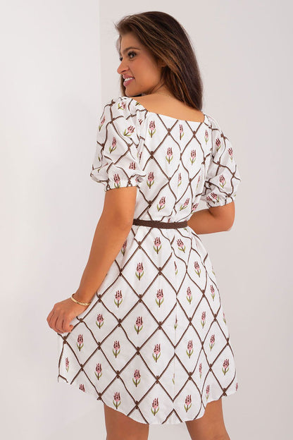 Back view of a luxurious floral embroidered cotton summer dress by Lakerta, highlighting the delicate puff sleeves and flattering flared design, perfect for fashionable summer occasions.