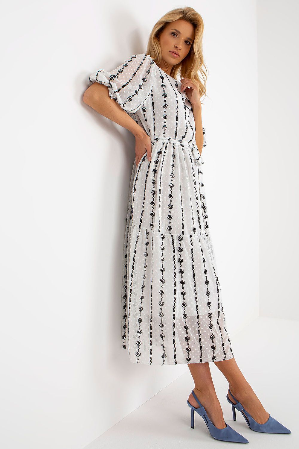 Elegant Lakerta midi cotton dress featuring frill sleeves and intricate embroidery, showcased in a luxurious setting, ideal for summer occasions.