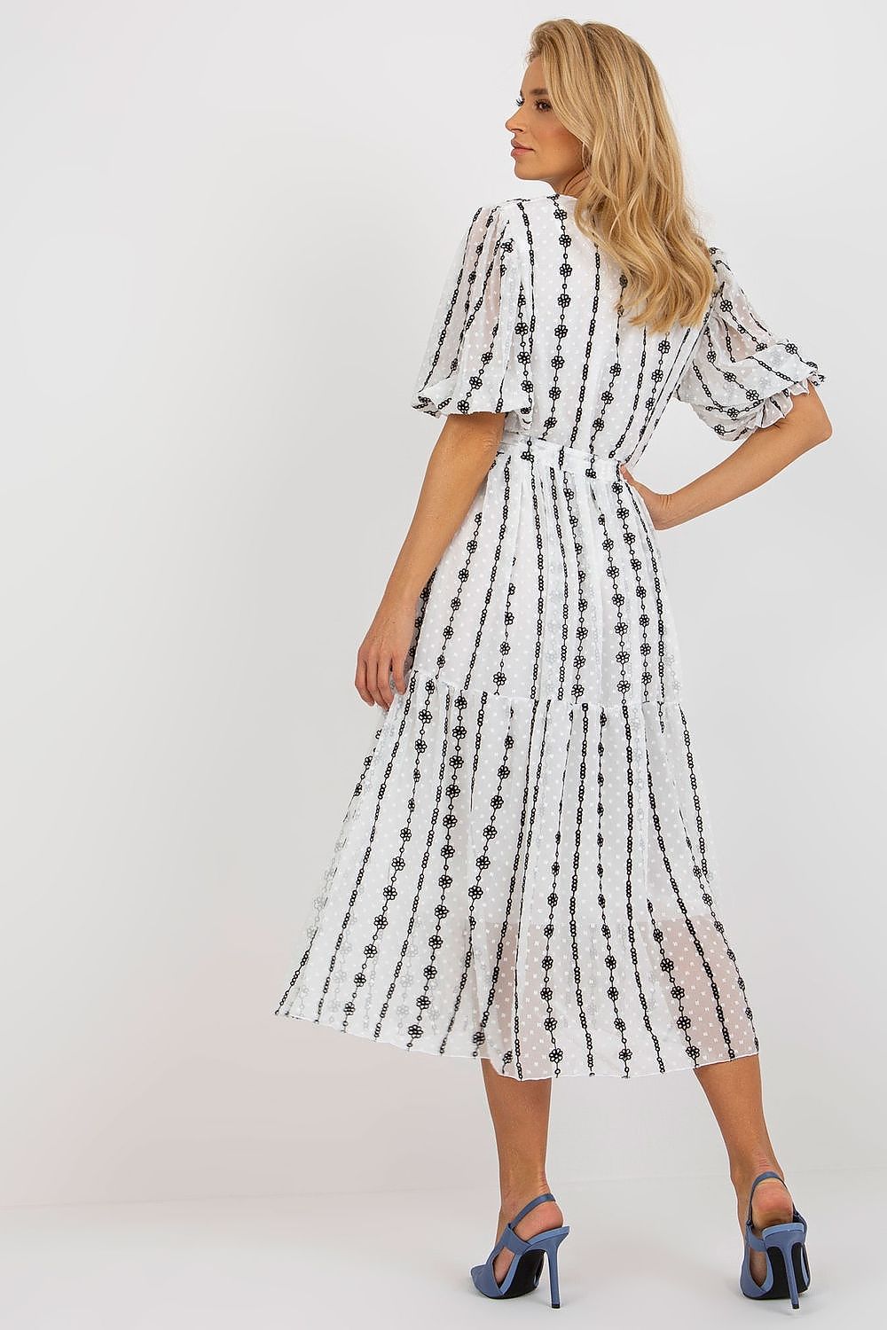Sophisticated back view of the Lakerta midi cotton dress, highlighting the romantic puff sleeves and unique embroidery, making it a standout choice for casual elegance.
