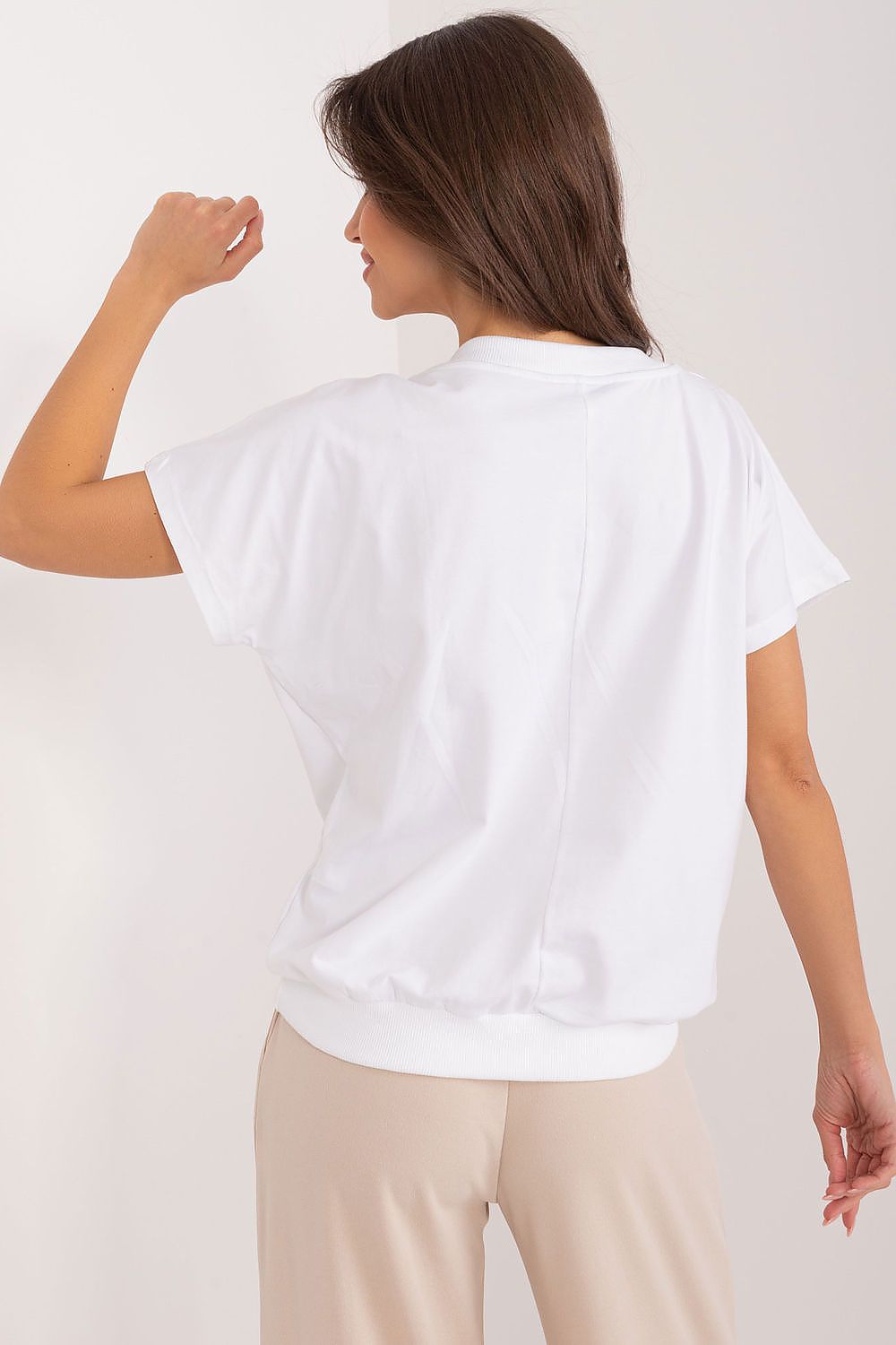 Back view of an elegant cotton blouse by Rue Paris, showcasing a comfortable fit with short sleeves and a sophisticated design, perfect for casual elegance.