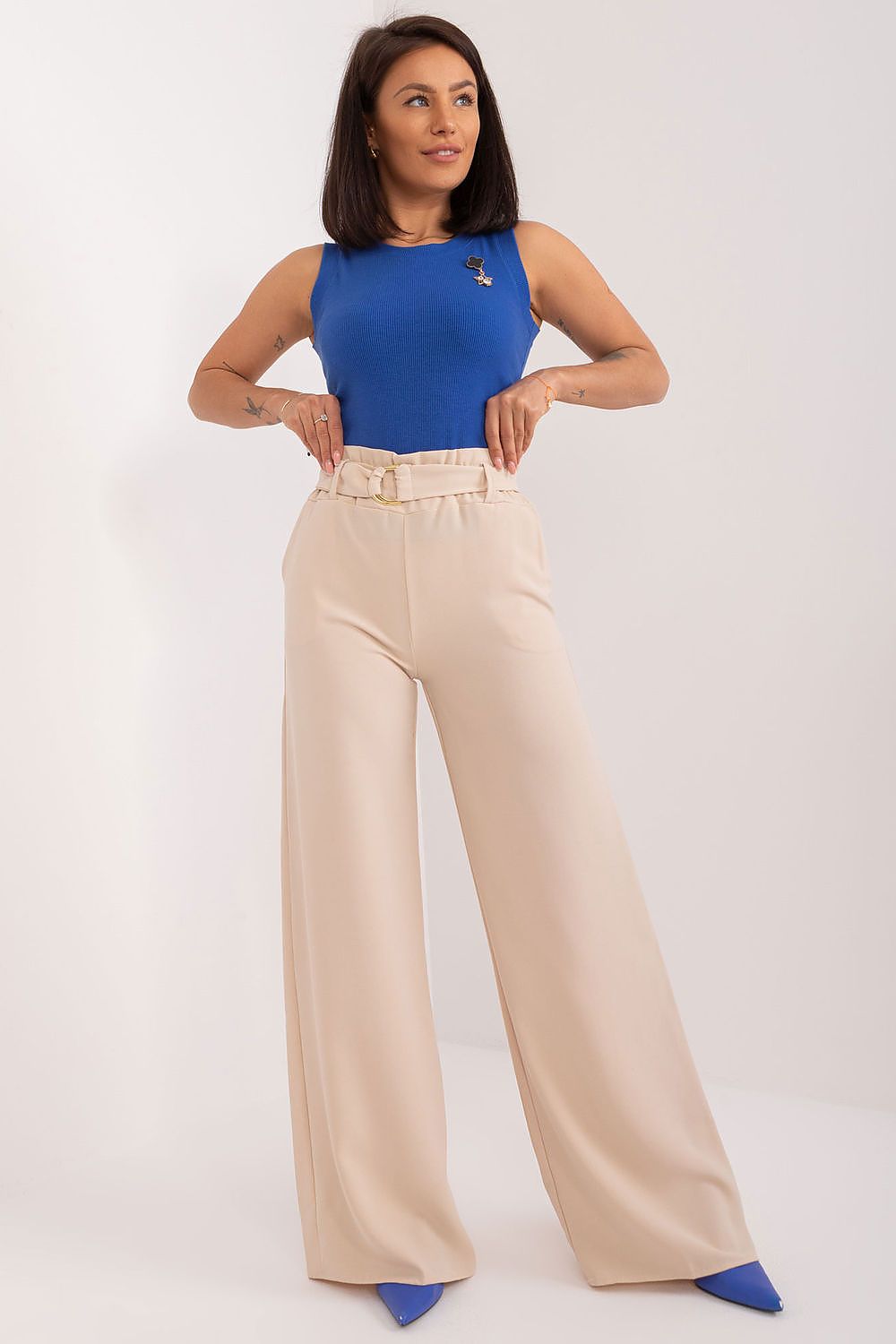 Elegant high-waisted wide-leg trousers with buckled waistband by Rue Paris, styled with a blue fitted top, showcasing a sophisticated look for formal occasions.